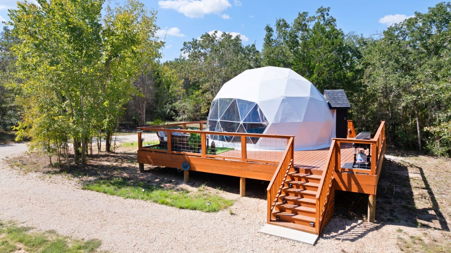 The Desert Rose geodome and private deck, ready for a glamping weekend near Austin