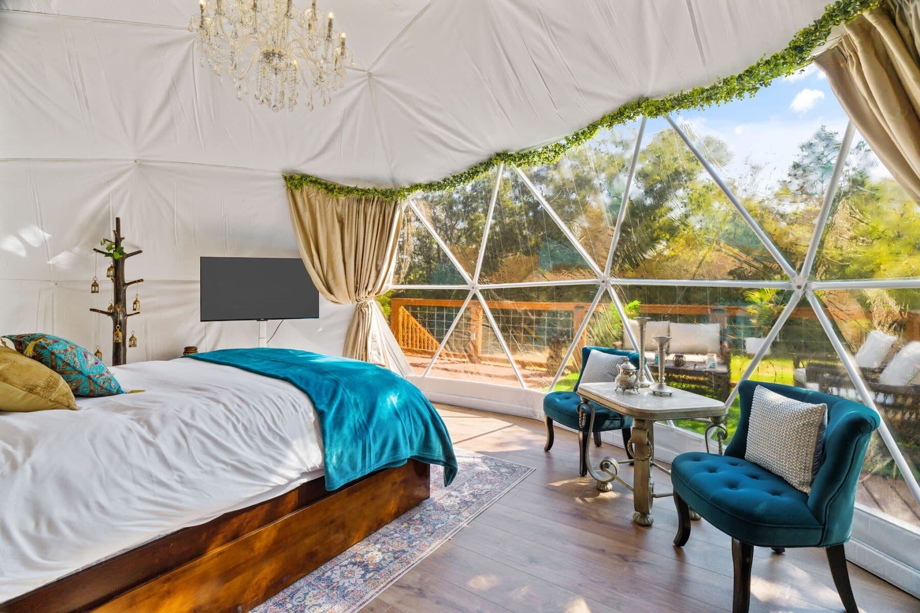 Desert Rose geodome suite with a crystal chandelier, a geodome stay in Texas near Austin